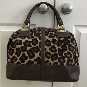 Fabulous dark brown leather handbag with animal print cowhide in the front